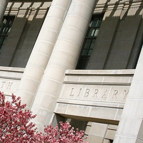 Kelvin Smith Library building in the springtime with a flowering tree