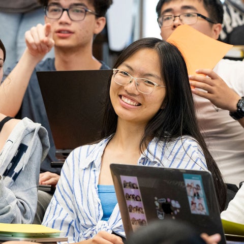 Photo of a student smiling in a classroom at CWRU