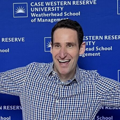 Reid Tileston celebrating after the successful defense of his thesis