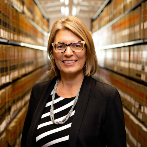 Jessie Hill photographed in a library