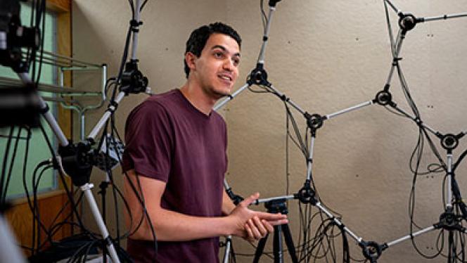 Photo of an OpsiClear employee with the company's device