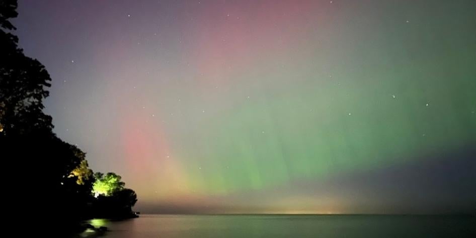 The rare spectacle of the aurora borealis lights up the Cleveland sky. Photo by Lex Ehrenschwender.