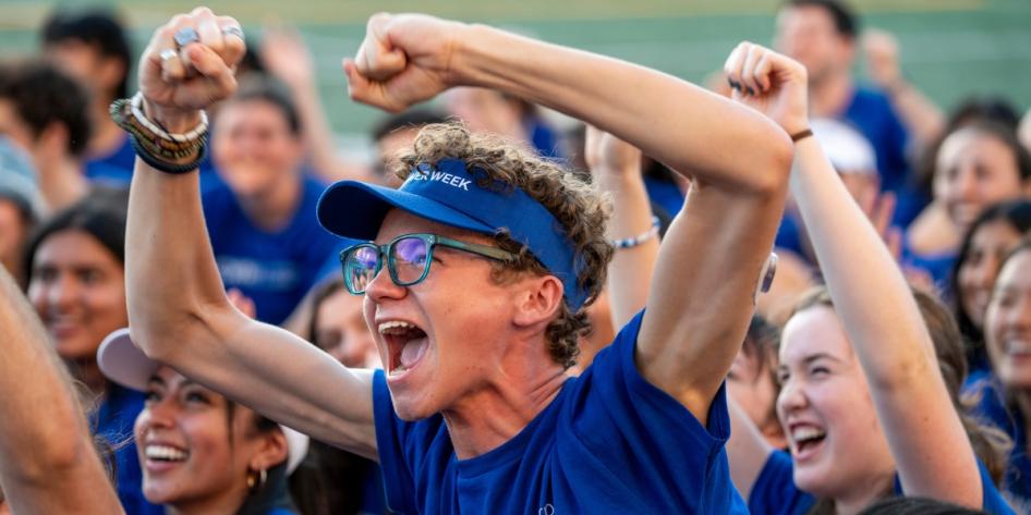 With boundless energy, an orientation leader greets students at CWRU during Discover Week.