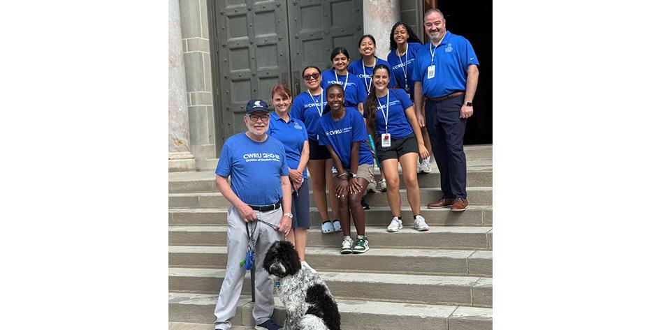 President Eric W. Kaler and his dog, Lulu, as well as Provost Joy K. Ward and Vice President for Student Affairs Travis T. Apgar pose with orientation leaders