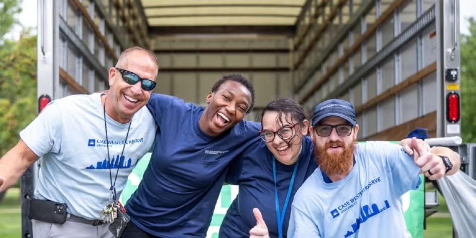 Four CWRU move-in volunteers pose for a group photo.