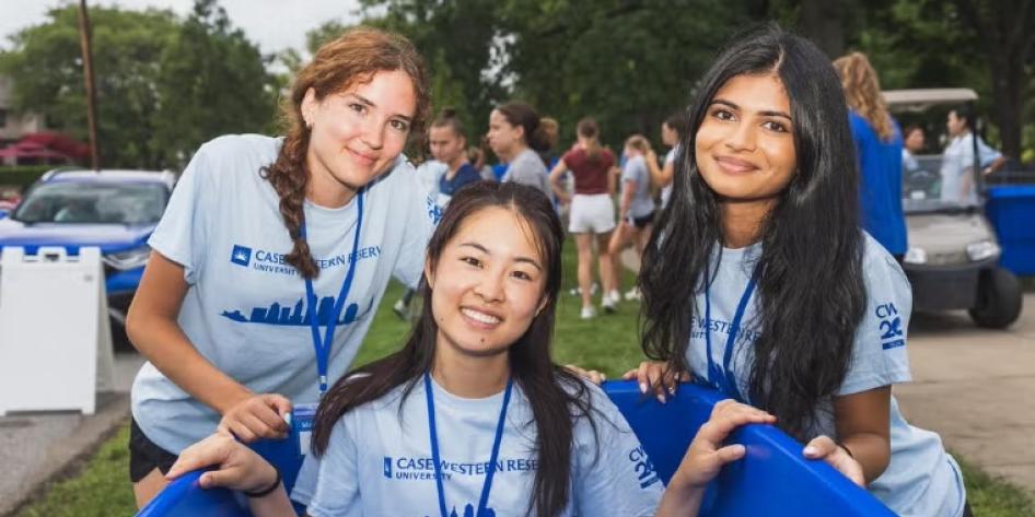 Three CWRU student move-in helpers stop for a photo during move-in on August. 17.