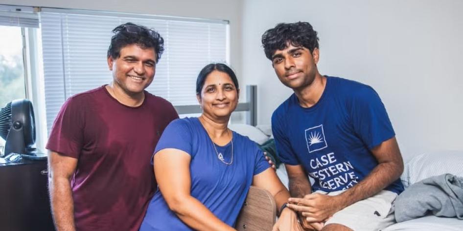 A CWRU student poses with family in their dorm room during move-in on Aug. 17.