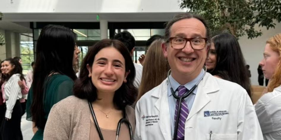 CWRU student and faculty at White Coat Ceremony