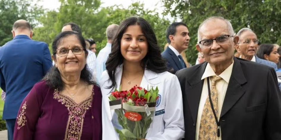 CWRU student and family at the White Coat Ceremony