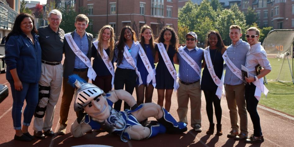 Spartie poses with staff and student members of the 2016 CWRU homecoming court. 