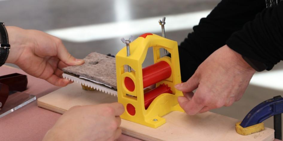 Close up of a 3D-printed printing press.
