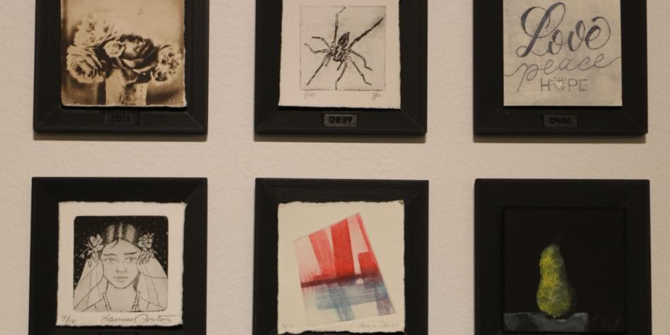 A display of original prints made at Sears think[box].