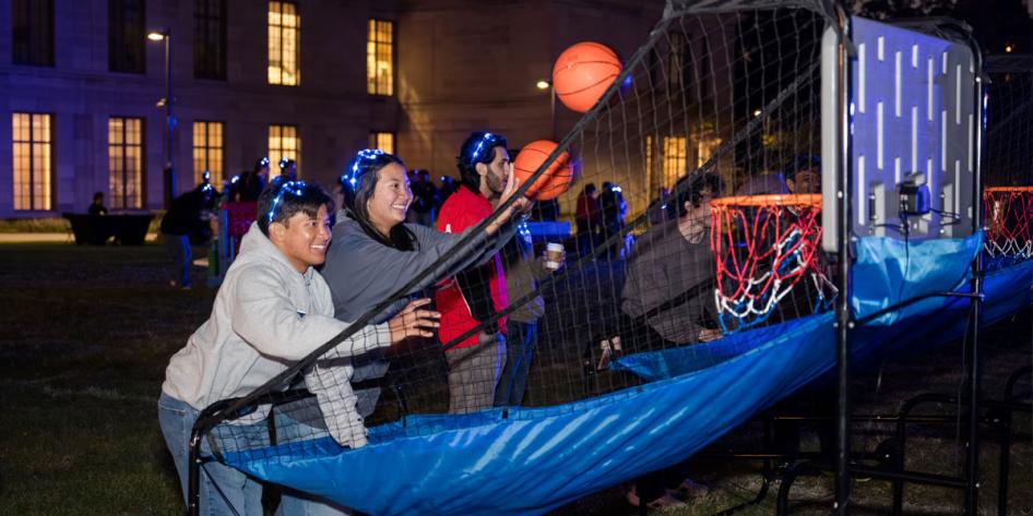 Two members of the CWRU community play games during Homecoming and Reunion Weekend 2025's Blue Bash.