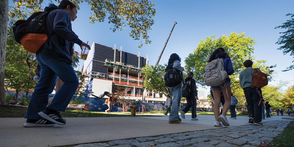 View of ISEB construction taken from the quad on a sunny day with students walking by