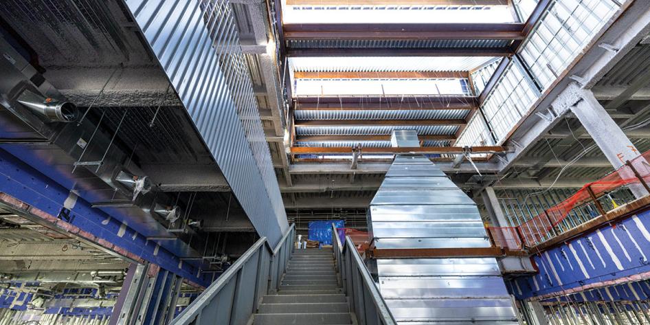 ISEB interior construction photo showing a staircase and metal vent