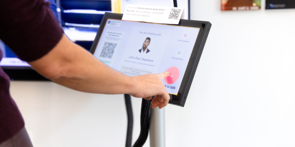 Student interacting with display screen Weatherhead