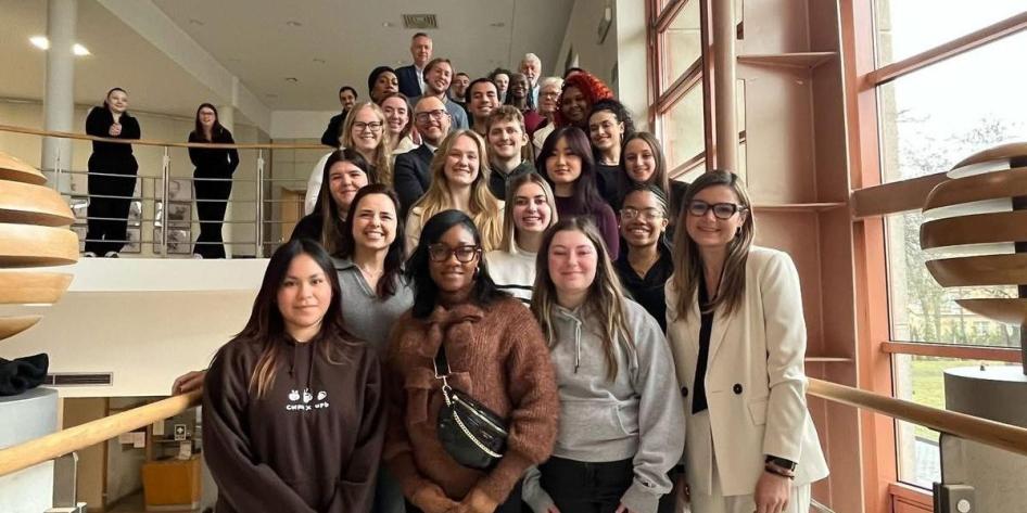 Shyanne Urban and fellow classmates of the Invisible Groups in a New Poland program attend a presentation on racism and discrimination at Adam Mickiewicz University. 