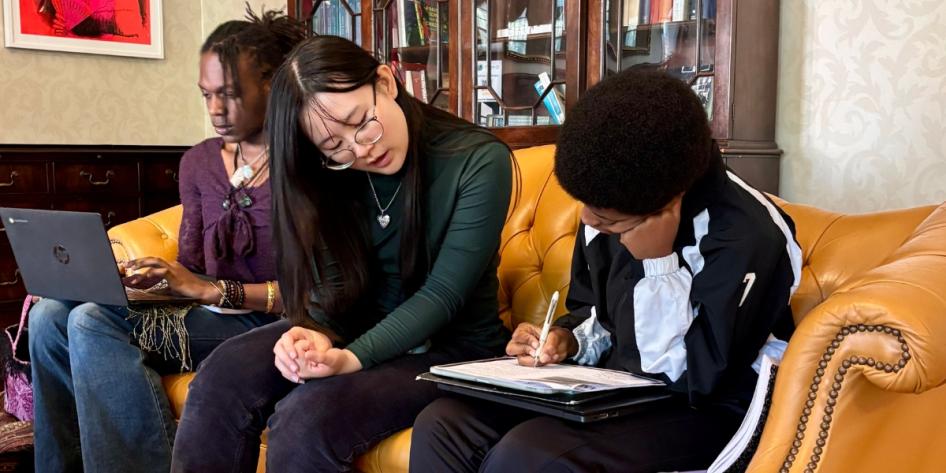 A CWRU student tutor with two Provost Scholars Program participants.