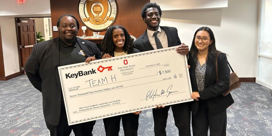 Kofi Osei-Tutu and team pose with first-place check at the 18th annual KeyBank Leadership and Creativity Undergraduate Student Symposium. 