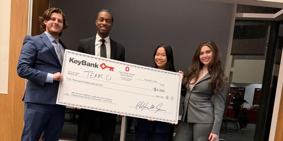 Zane Kuhnle and team pose with second place award check at the 18th annual KeyBank Leadership and Creativity Undergraduate Student Symposium. 