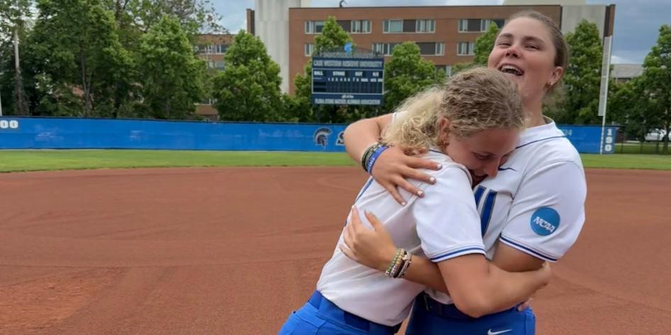 Karen Potts hugs softball teammate. 