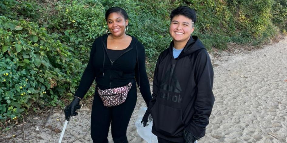Nyla Williams (pictured left) and a member of CWRU's Street Law organization assist with beach cleanup. 