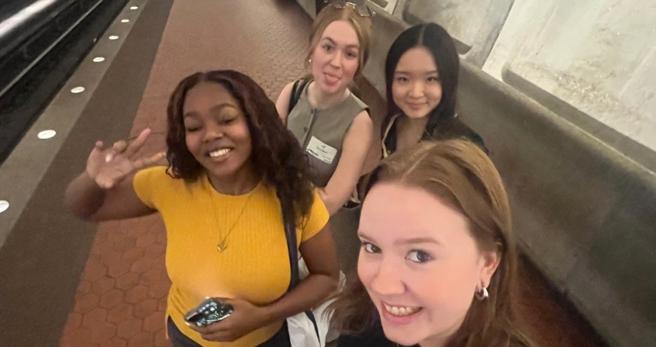Caley Nee stops for a quick photo with classmates Sharese Lucas, Kaitlin Wang and Claudia "Scout" Rainey in a D.C. metro station before heading to their next meeting.