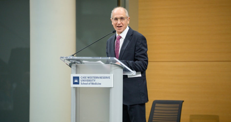 Dean Gerson speaking at a podium during Match Day