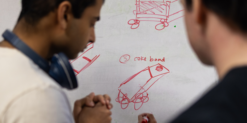 Image of students drawing plans for the Build-a-Boat Challenge