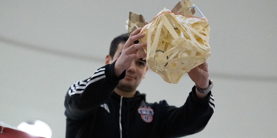 Image of students about to drop their protected lightbulb