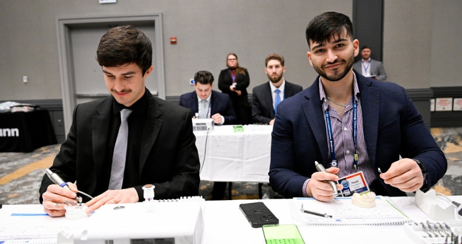 Fouad Ahmed and peer at School of Dental Medicine