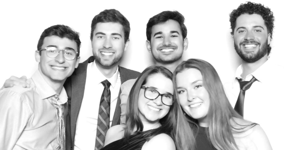 Luaren Tipping and other students take a group photo at a School of Dental Medicine formal.  