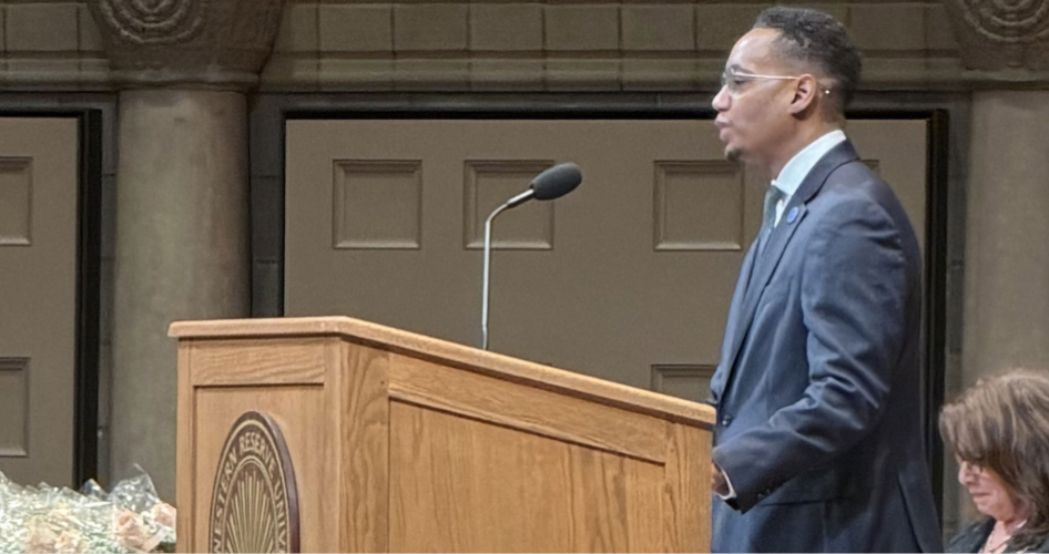 Dean Hickman stands at a podium