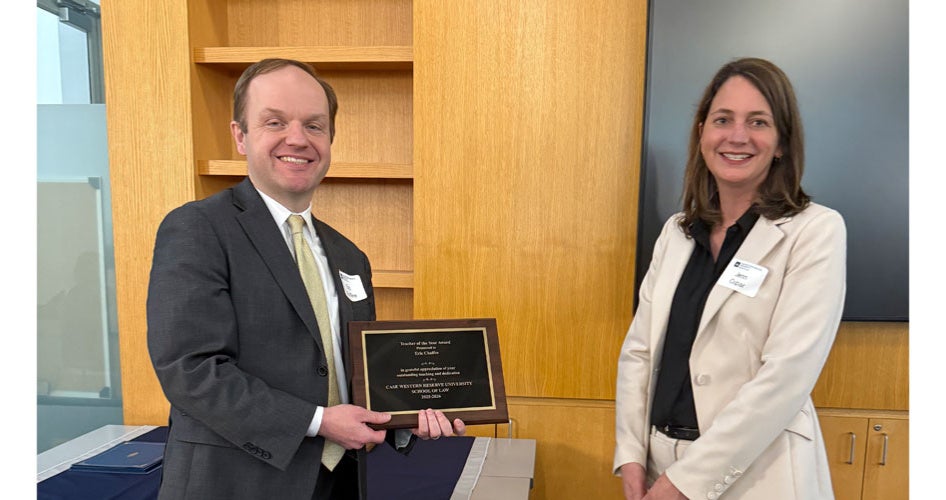 Eric Chaffee holding a plaque with Jenn Cupar