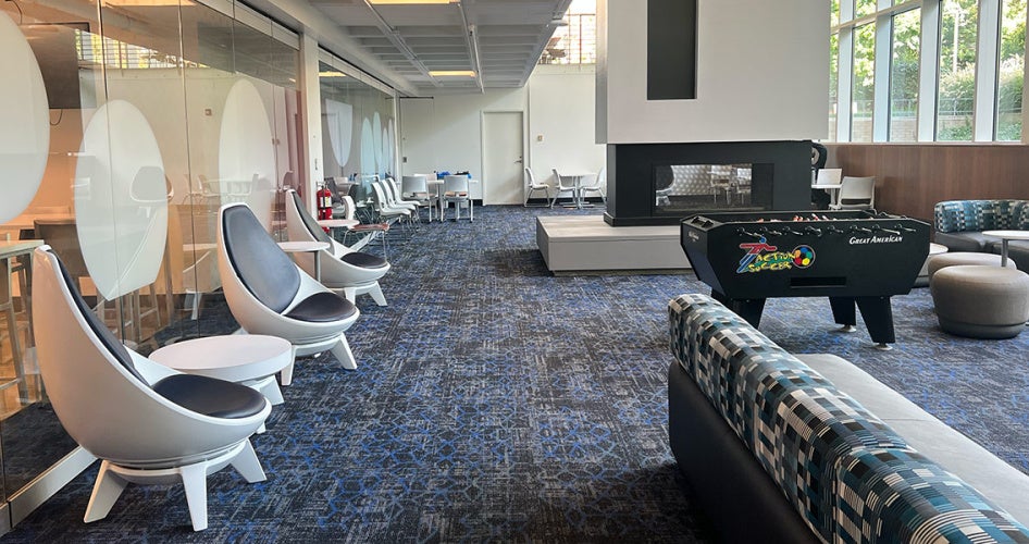Photo of seating options and a fireplace in the Fireside Lounge