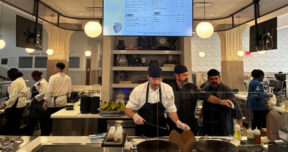 Employees in Tomlinson Hall's new dining space work together to fill orders