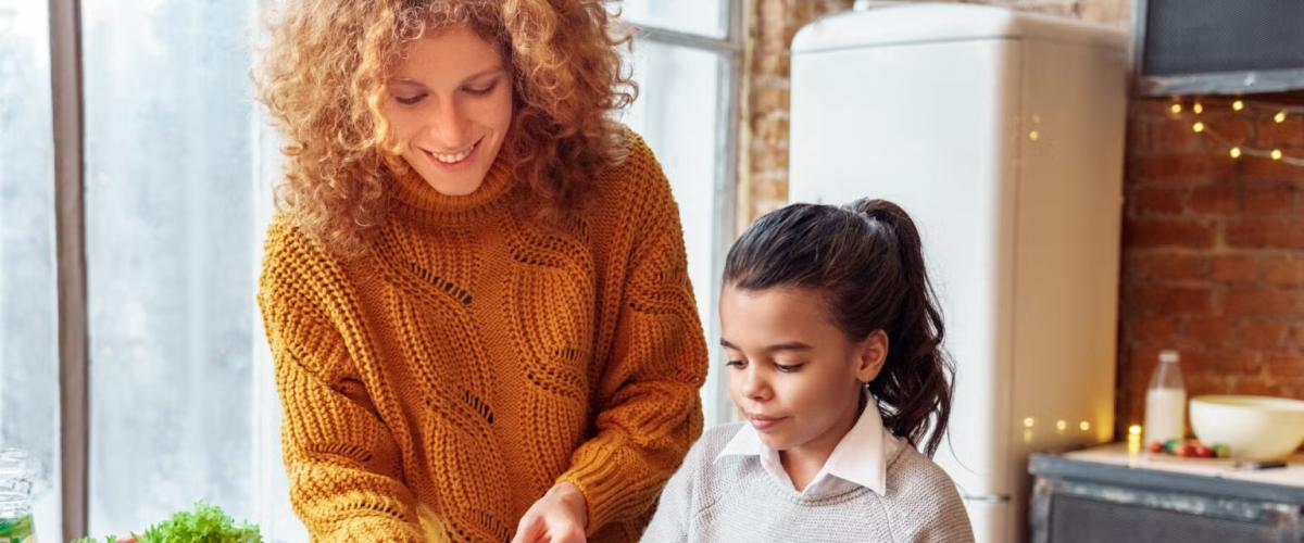 Woman and child making a salad