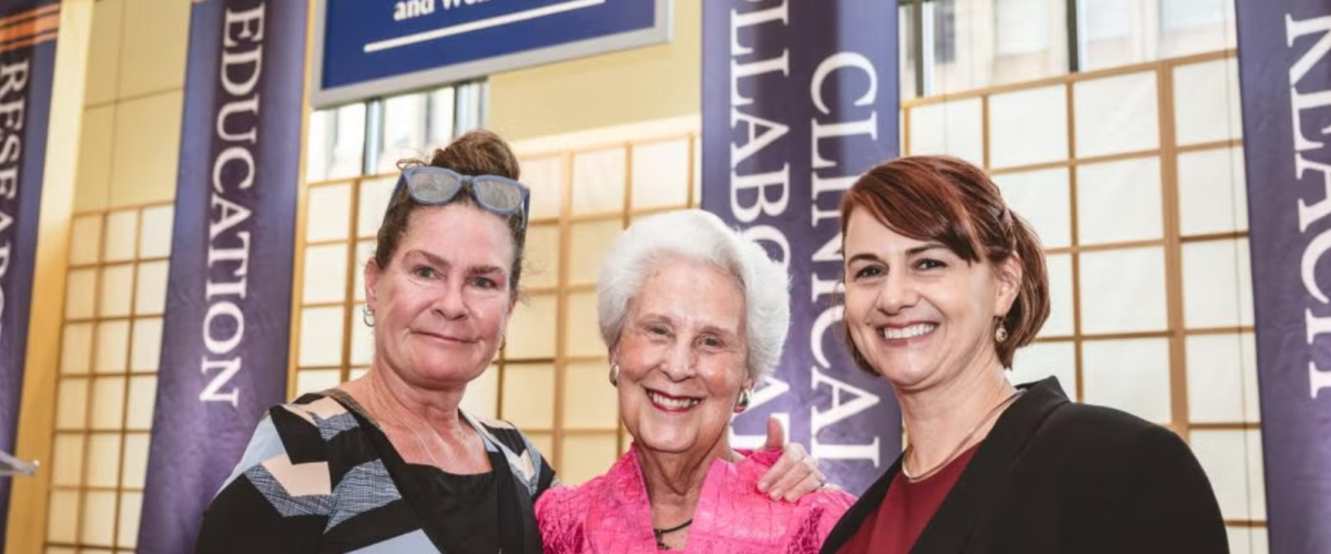Norah Feeny, Sara Moll and Provost Joy Ward pose for a photo