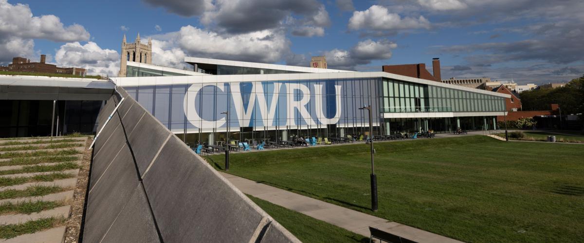Photo of Tinkham Veale University Center on a sunny day with CWRU signage on the windows