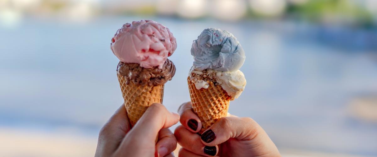 Close up of two ice cream cones.