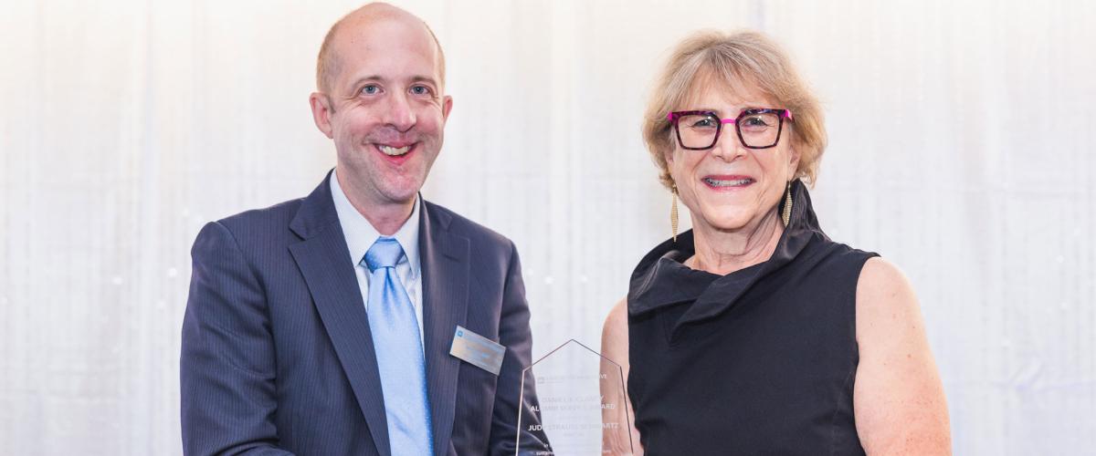 Case Western Reserve University alumni Nicholas Zalany and Judy Strauss-Schwartz pose with an award