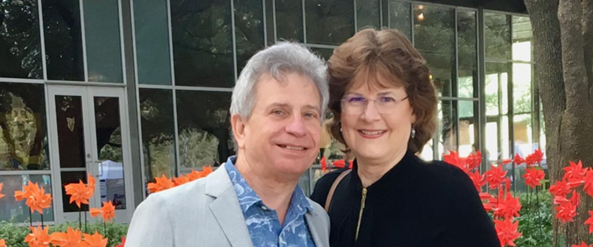 Ed and Joyce Lehotsky pictured together outside standing in front of flowers