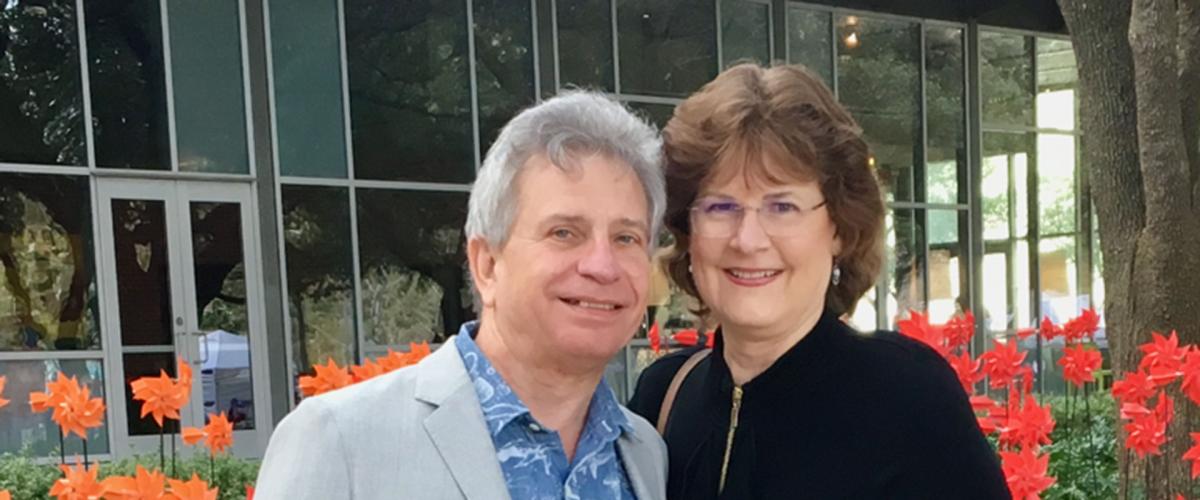 Ed and Joyce Lehotsky pictured together outside standing in front of flowers