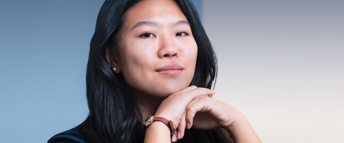 Logan Tsukiyama posed with her chin on her hands