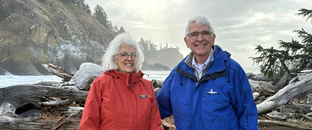 Ed and Melinda Sadar in the mountains wearing winter gear