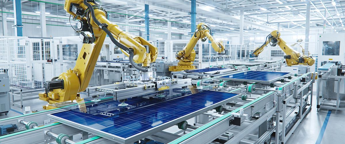 Photo of machines assembling solar panels in a factory