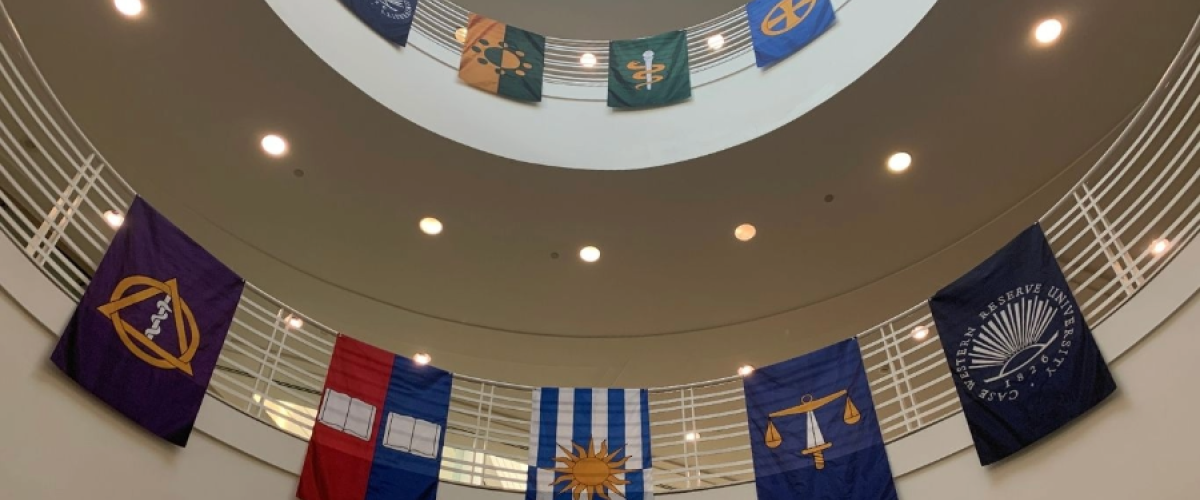 Image of a large stairway area with banners displayed across railings