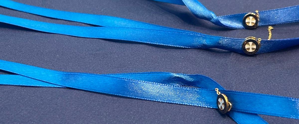 Frances Payne Bolton School of Nursing nursing pins on blue ribbons