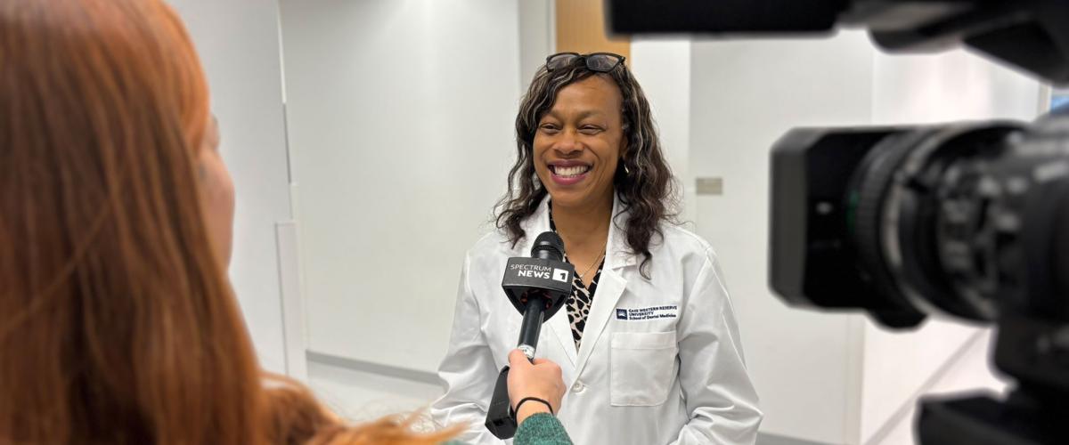 Photo of School of Dental Medicine faculty member Kristin Williams being interviewed by the news
