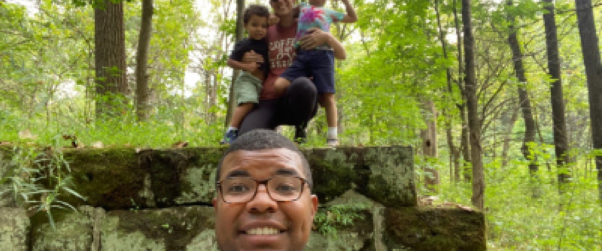 Brock Montgomery hiking with his wife and two children